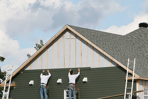 Professional Siding Contractor technician working in Amityville, NY